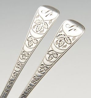 A set of six George III silver Old English teaspoons with bright-cut foliate stems and initialled te