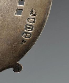 A George III silver fish slice, the oval blade with engraved and pierced border, monogram with wreat