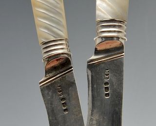 A cased composite set of twelve Georgian knives, having reeded mother-of-pearl mounted handles and s
