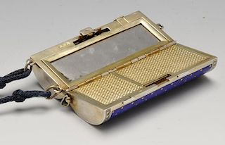 A 1920's Scottish import silver-gilt and enamel minaudiere, the hinged cylindrical body with blue gu