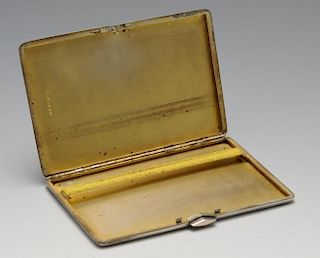 A 1930's silver cigarette case of oblong form with engine-turned decoration, gold tone border and op