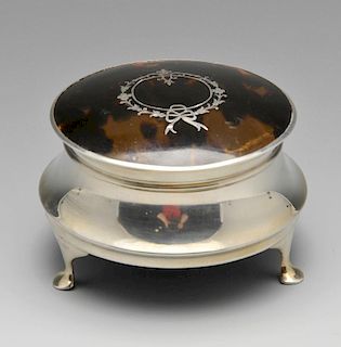 A 1920's silver tortoiseshell jewellery or trinket box, the circular capstan body with hinged tortoi