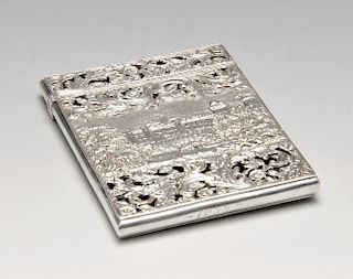 An early Victorian silver 'castle top' card case by Nathaniel Mills, decorated to the front with a v