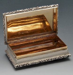 An early Victorian silver snuff box by Nathaniel Mills, the oblong form with engine-turned decoratio