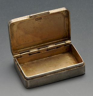 A 1960's silver small snuff or pill box, of plain rectangular form having engine-turned exterior to