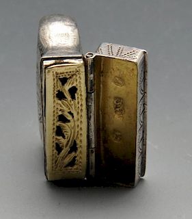 An early to mid-nineteenth century novelty vinaigrette modelled as a purse with vermicular engraving