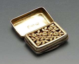 A George III silver vinaigrette, the small plain oblong form with initial engraving opening to a pie
