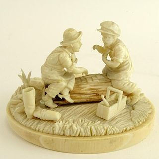 Antique Continental Carved Ivory Group Depicting Two Men Playing Cards on a Log. Finely detailed.