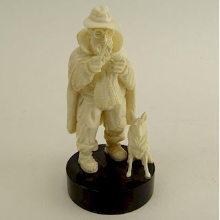 Antique Continental Carved Ivory Figure of a Poor Man, Knitting with Dog.