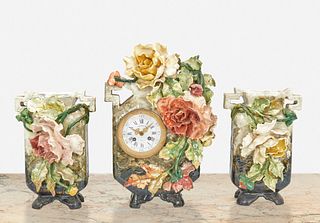 A French Art Nouveau glazed ceramic clock set