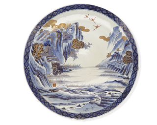 A large Japanese Arita porcelain charger, by Aoki Kyodai-Shokai