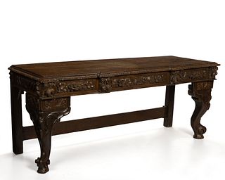 A large Continental Baroque-style carved oak side table