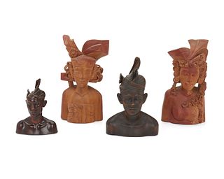 Four Balinese carved wood commemorative busts
