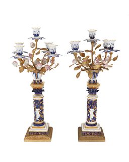 A pair of Continental porcelain candelabra