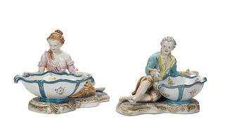 A pair of Meissen-style figural sweet meat porcelain dishes