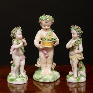 Group of Three English Porcelain Putti with Garlands