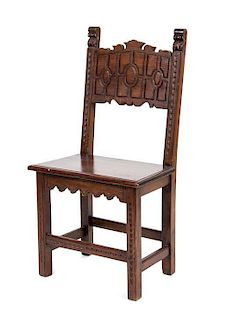 A Jacobean Style Walnut Hall Chair Height 39 1/2 inches.