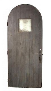 A Domed Wood Door Height 100 7/8 inches x width 41 7/8 inches.