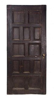 A Paneled Wood Door Height 83 1/4 x width 35 1/2 inches.