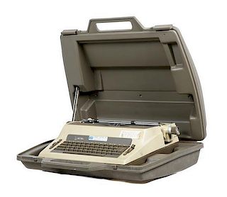 A Royal Portable Electric Typewriter and Case Length 14 1/2 inches x width 18 7/8 inches x height 4 1/2 inches.