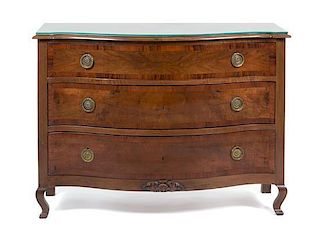 A Continental Walnut Chest of Drawers Height 34 1/2 x width 47 1/4 x depth 20 inches.