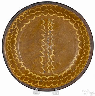 Mid-Atlantic redware deep dish, 19th c., probably Maryland, with yellow slip squiggle lines