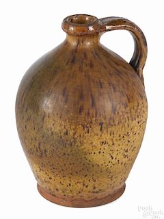 New England ovoid redware jug, 19th c., probably Maine, with speckled manganese decoration