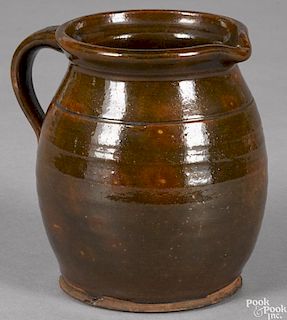 New England redware pitcher, 19th c., 5 1/2'' h.