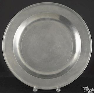 English pewter platter, 19th c., 17'' l., 22 1/4'' w., together with a charger, 16 1/2'' dia.