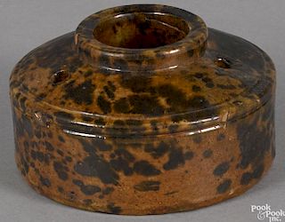 Pennsylvania redware inkwell, 19th c., with mottled brown glaze, 3'' h., 5 1/4'' w.