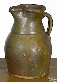 Pennsylvania or Maryland redware pitcher, 19th c., with green and brown glaze, 9 3/4'' h.