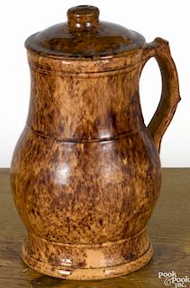 Pennsylvania redware pitcher and cover, 19th c., impressed John Bell