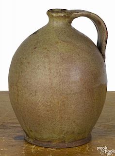 New England redware jug, 19th c., with unusual mottled green glaze, 8 3/4'' h.