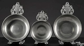 Three New England pewter porringers, ca. 1800, two bearing the touches IG and SG