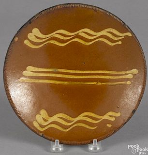 Pennsylvania redware pie plate, 19th c., with yellow slip decoration, 8 3/8'' dia.
