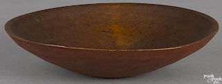 Turned and painted wood bowl, 19th c., retaining an old red surface, 12 1/4'' dia.