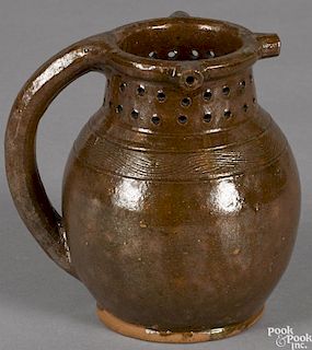 American redware puzzle jug, 19th c., 6'' h.
