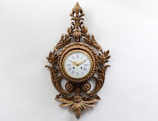 LOUIS XVI STYLE CARVED AND GILTWOOD CARTEL CLOCK