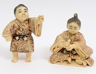 TWO CARVED IVORY FIGURES OF CHILDREN