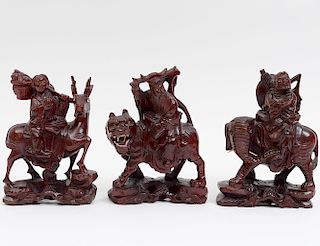GROUP OF THREE CARVED ZITAN IMMORTALS