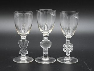 Group of Ten Lalique Cordials, with figural stems, height 4.5 inches.