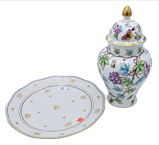 Two Herend Porcelain Pieces, to include covered urn or jar, having blossoming flowers butterflies and leaves along with a large charger, marked for He