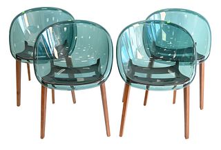 Set of Four Calligaris Bloom Chairs, having wood legs, lucite seat, made in Italy.