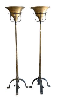 Pair of Torchiere Floor Lamps, having incised brass shaft on iron base, height 71.5 inches.