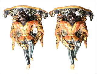 Pair of Blackamoor Figural Wall Shelves, each painted cast resin figures with drapes, height 18 inches.