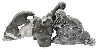 Group of Four Eskimo Carved Sculptures, to include Peter Tuki Walrus, carved head with bird headdress, kaling carved bird, and an Eskimo figure with s