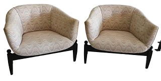 Pair of Castro Convertible Bucket Chairs, having three legs with flame stitch upholstery and ebonized legs, height 24 inches, width 31 inches.