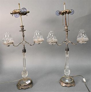 Pair of Silver Plated and Glass Candelabras, having silver plated center candle holder flanked by glass bobeches on glass shaft and silver plated base