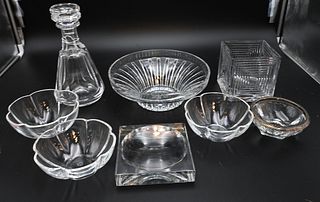 Eight Piece Baccarat Group, to include large bowl, square vase, decanter, set of three bowls, square ashtray, and an ashtray with silver top, tallest 