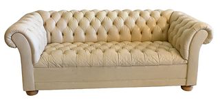 Chesterfield Leather Upholstered Sofa, having rolled arms and bun feet, height 28 inches, length 76 inches.